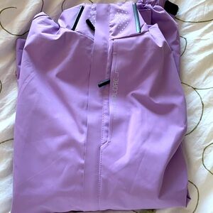 breathable windbreaker w/ removable & adjustable hood. A tiny stain near pocket.